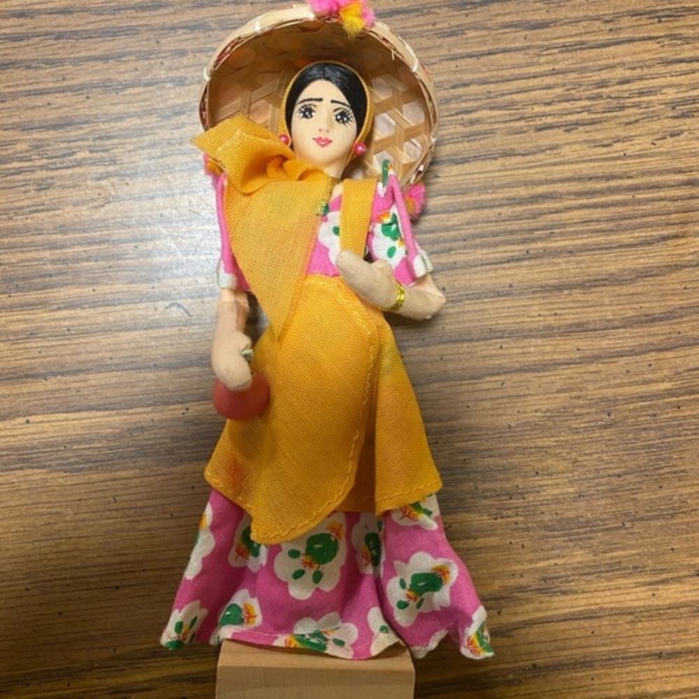 Dark haired woman doll/figurine